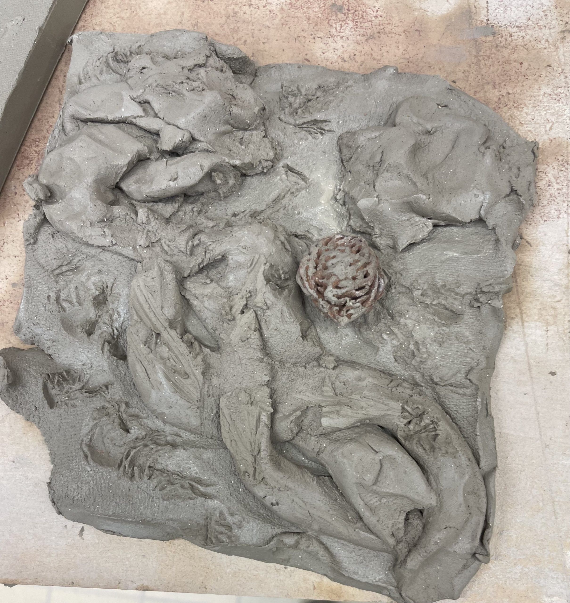 Laying  and plating clay then pressing a nut to create further imbalance created a busy organic texture 