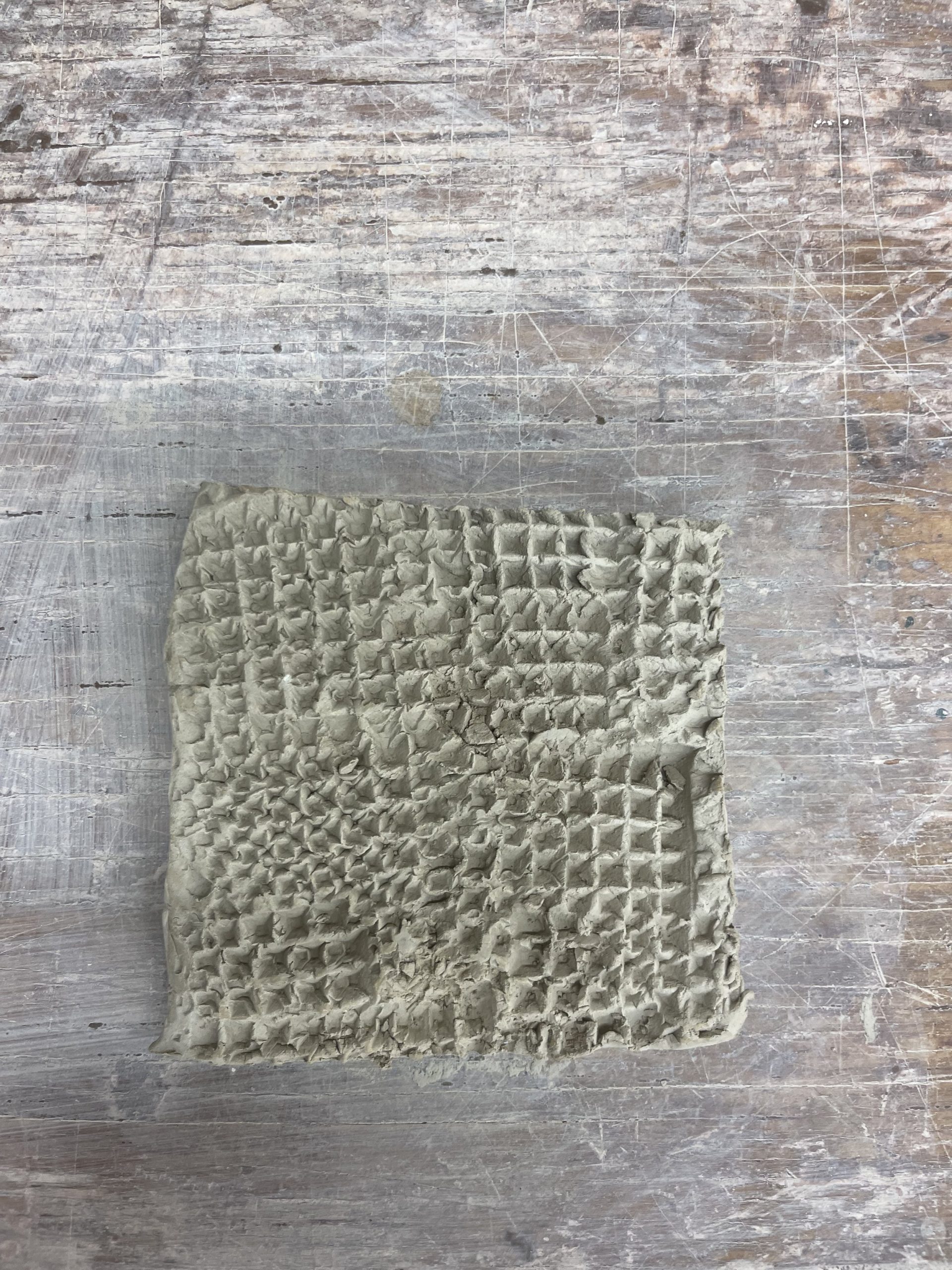  Pressing a sieve into wet clay produced a woven texture with many different shaped indentations. 