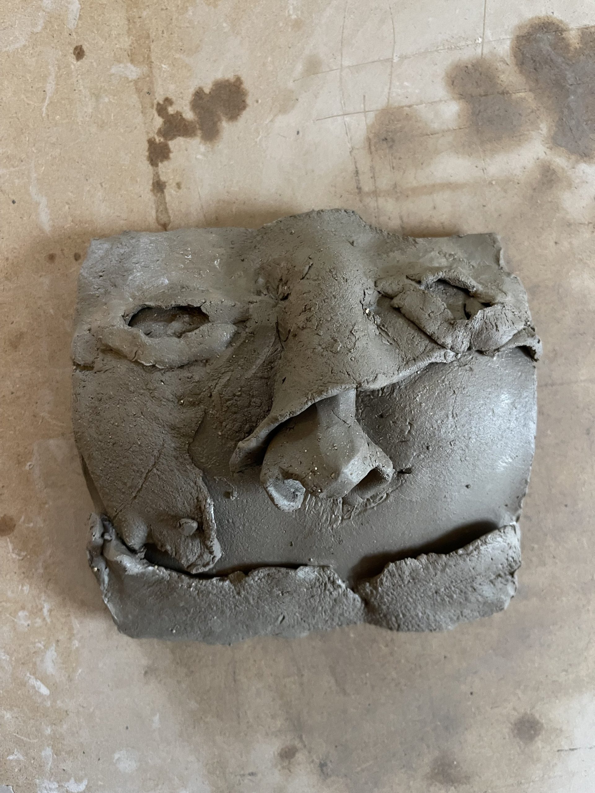  Overlapping clay using formed features on a soft tile that was then moulded from behind created facial features that took on textures and emotions of their own.Which could be the fear to getting something wrong or of not fitting in. 