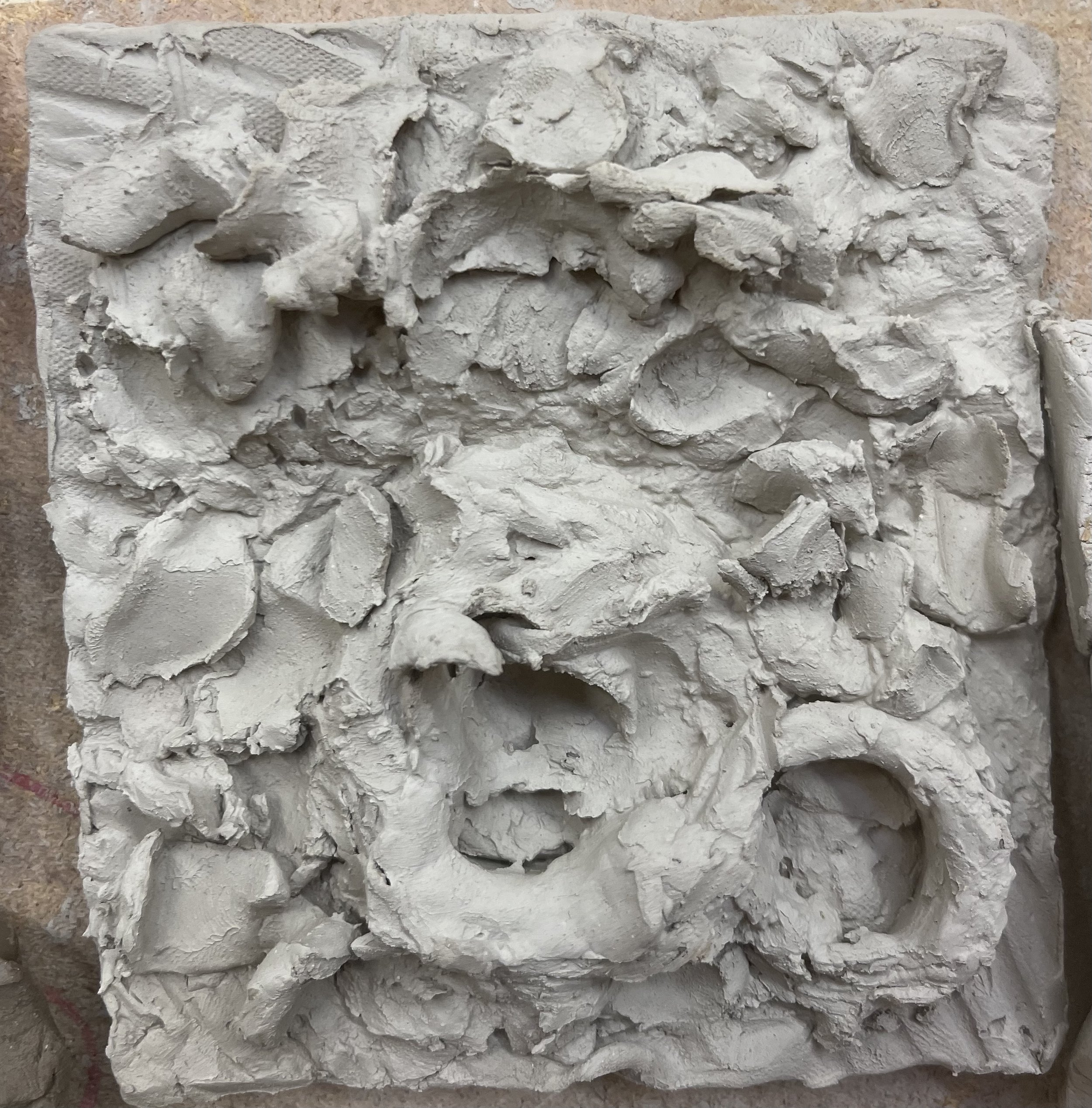  Lots of wet clay squeezed and mushed together to create a turbulent texture representing dilemma mixed feelings. 