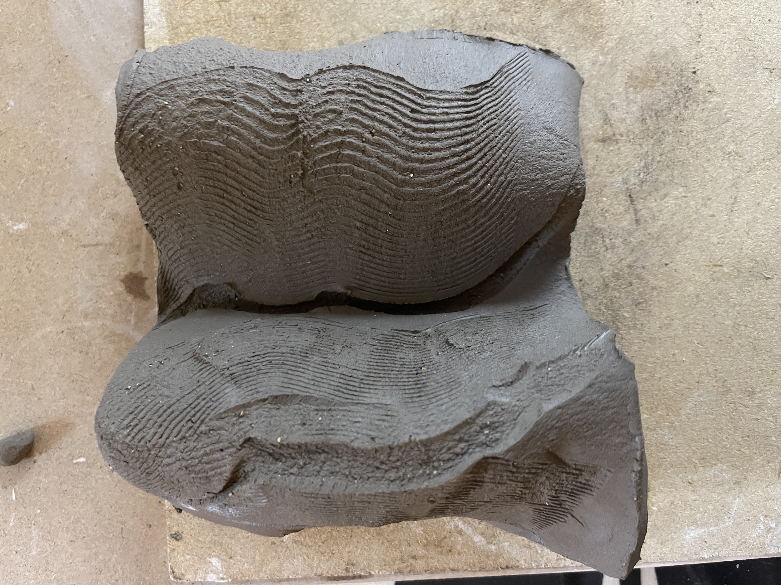  Soft clay tile that was scratched then bent in half created a cavernous surface almost a feeling of despair. 