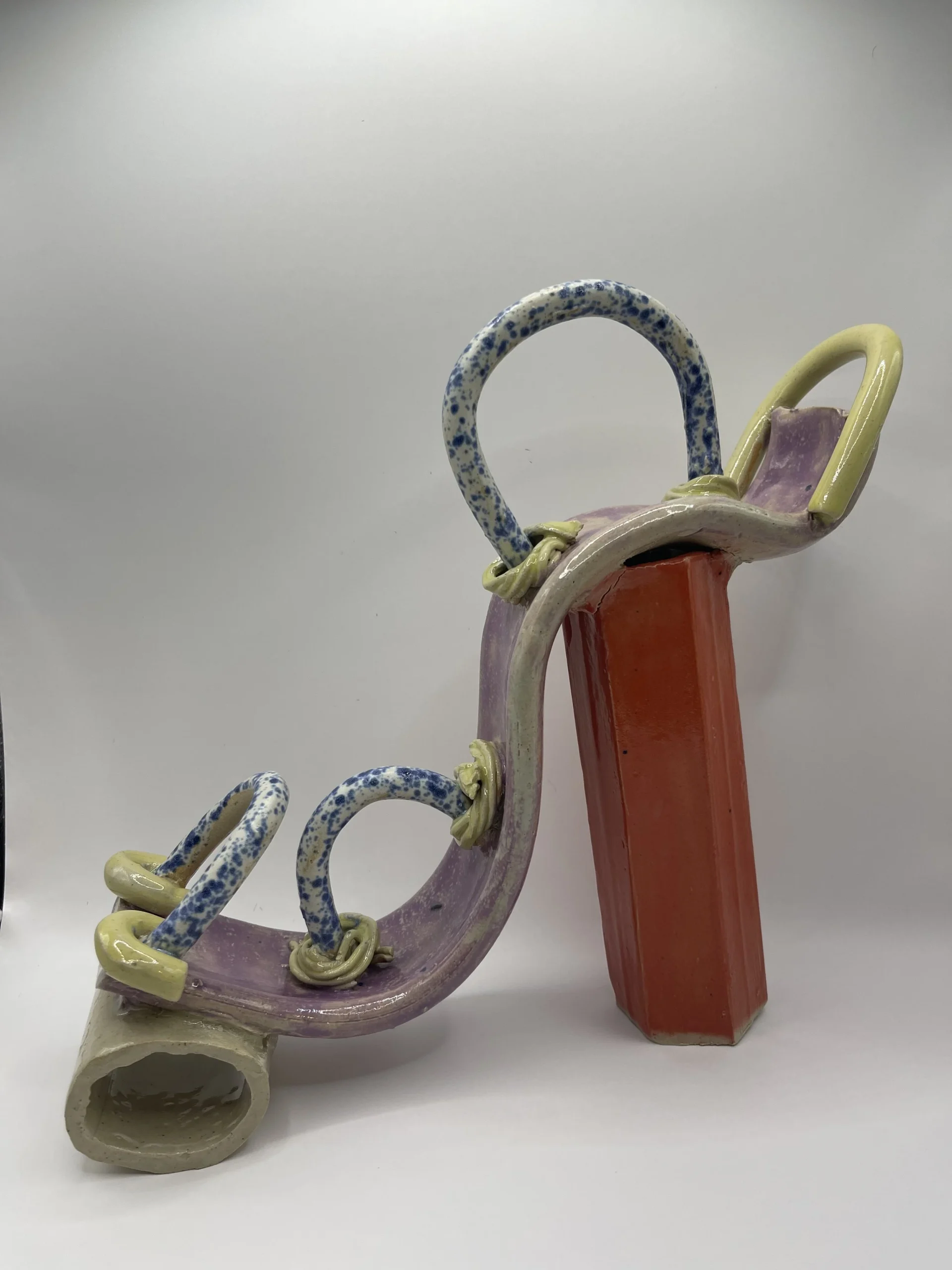  Again using a white stoneware clay I wanted to create a sexier shoe that appeared more refined. I used under glaze to try and develop a bright colour under a transparent glaze. 