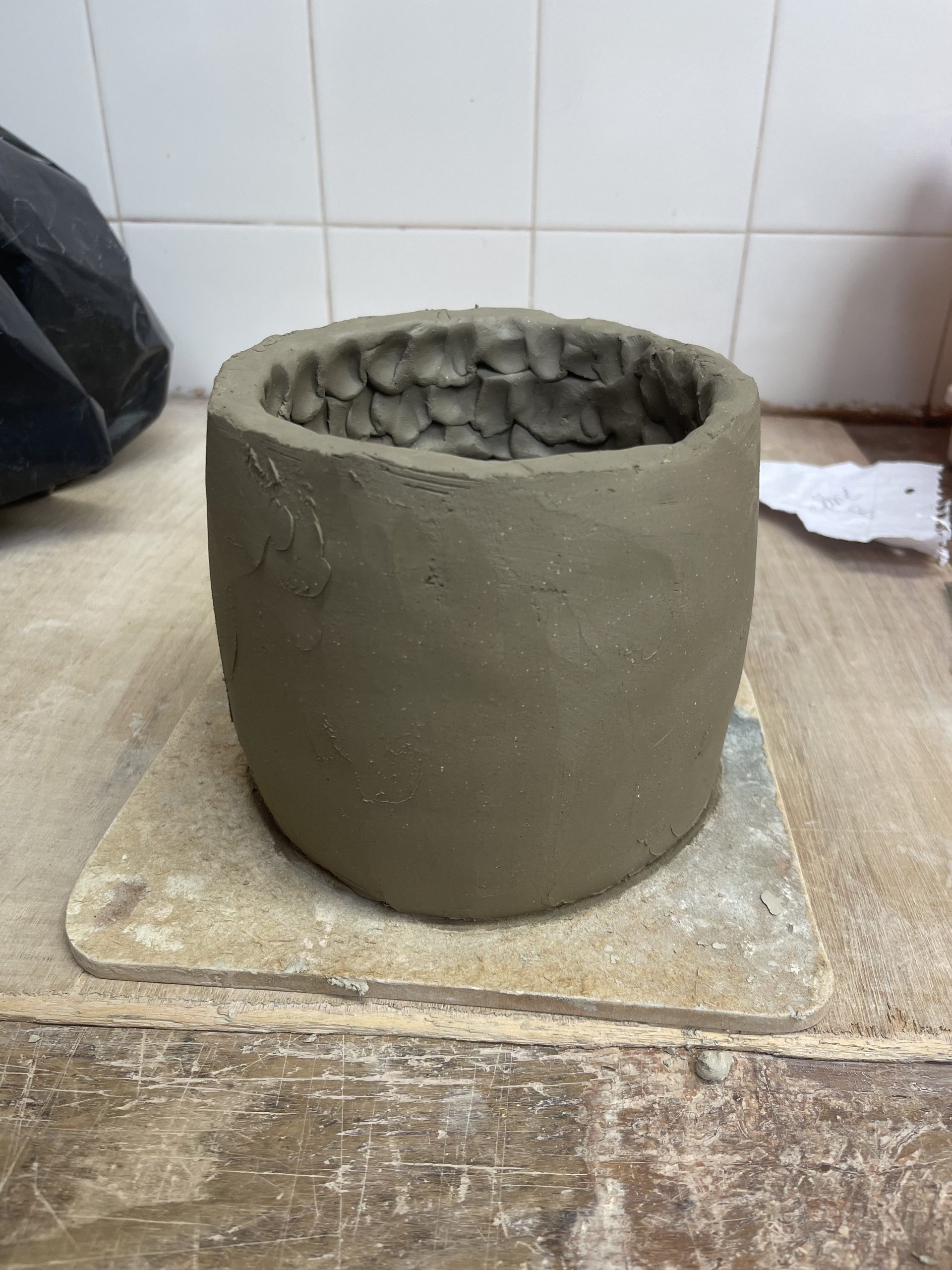  To create a straight sided form with a flat base I used coils building up and blending to about 12 cms  in height. I really liked the texture that the blending created inside the vessel. 
