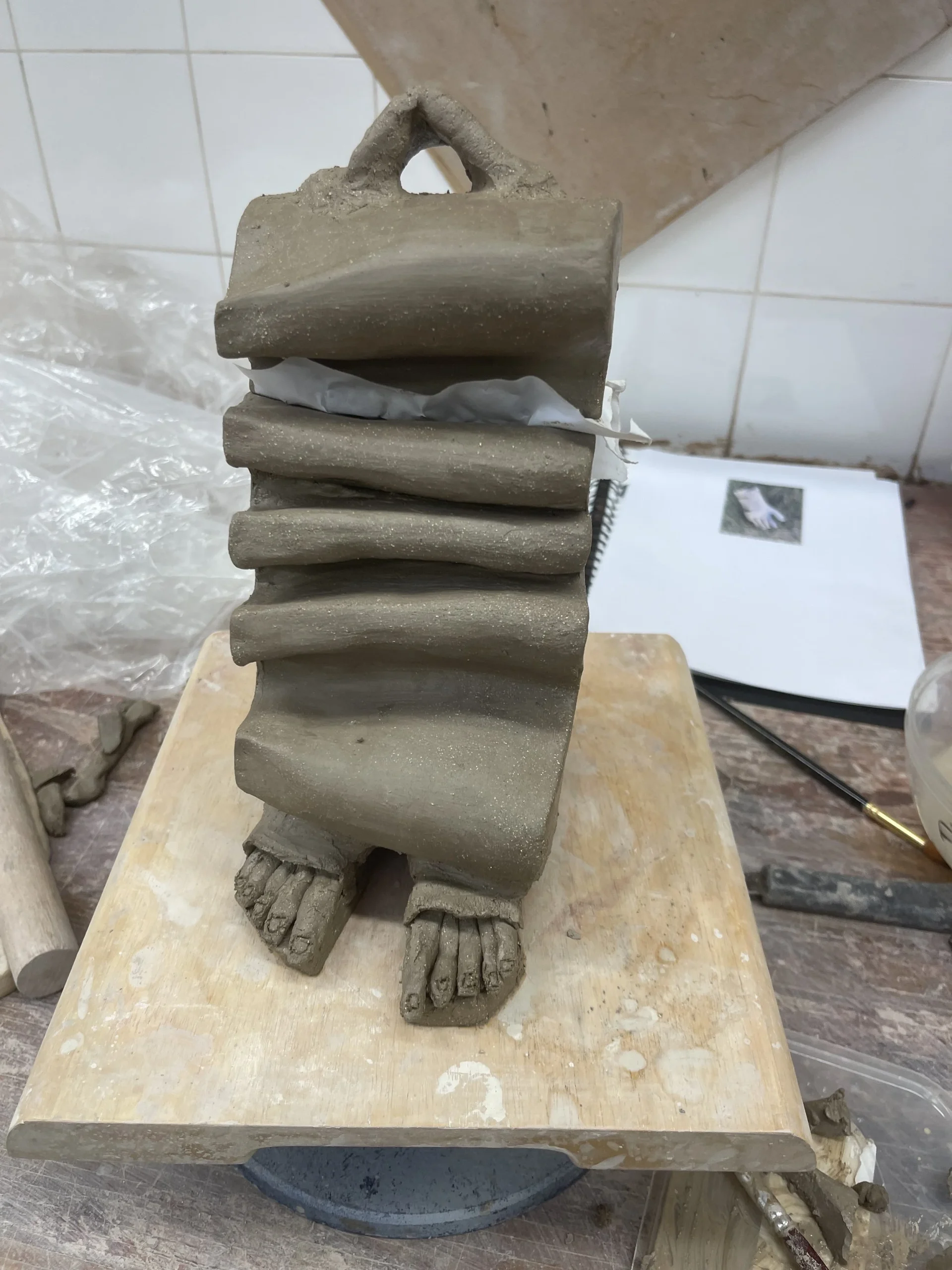  I explored the bone structure and using slabs of earthenware Mark Wright clay created a form based on bone structures. The bone imagery evolved from exploring my family history and how medicine has had a defining impact. 