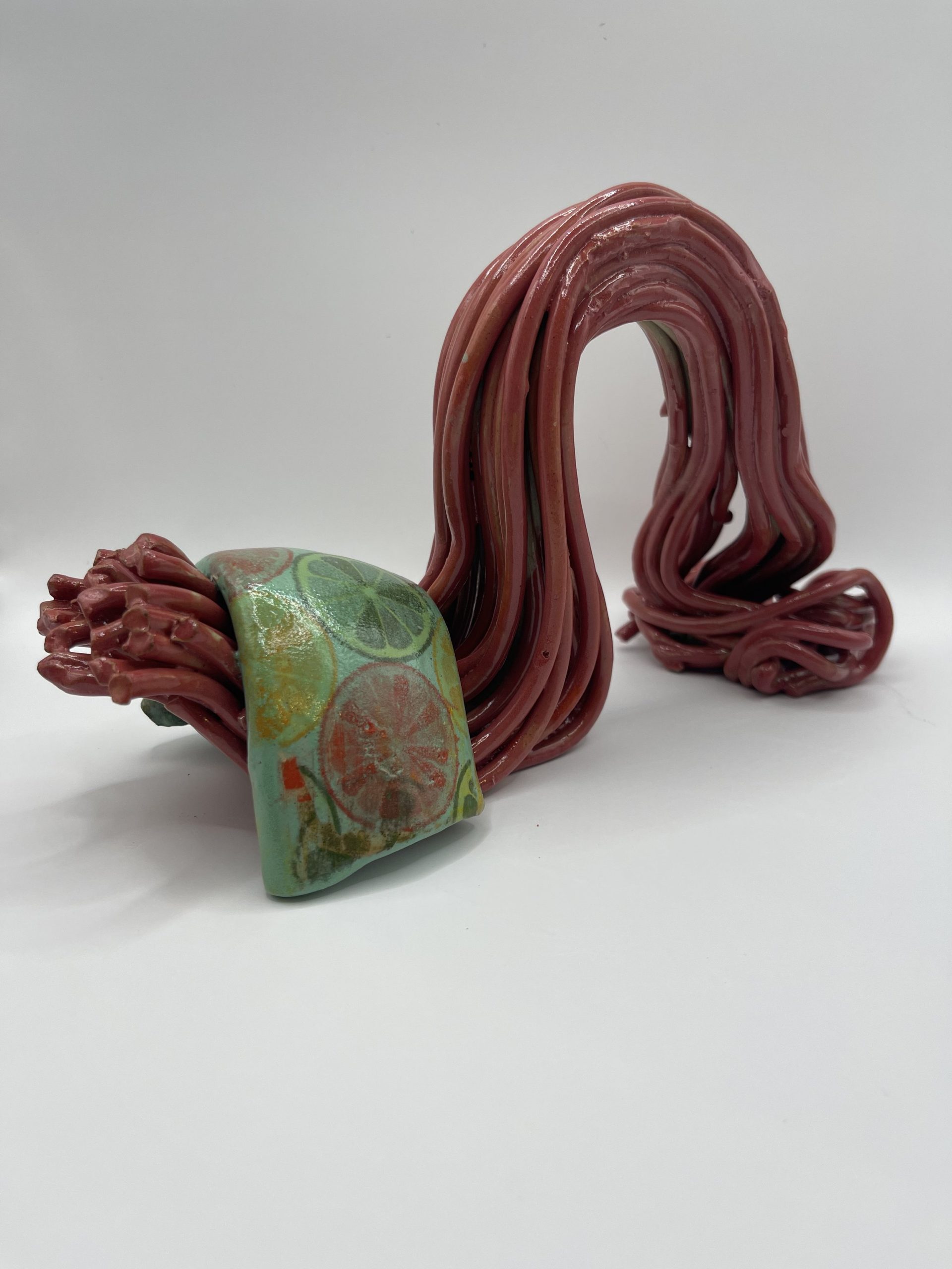  Fluid cheeky form using under glaze and decals. 
